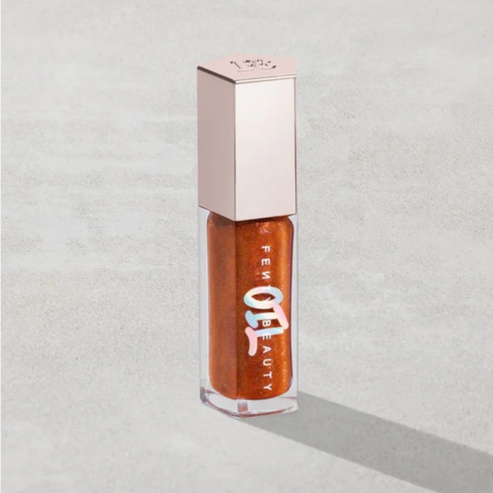 GLOSS BOMB OIL LUMINIZING LIP OIL 'N GLOSS Fro$ted Bunz - sparkling amber gold